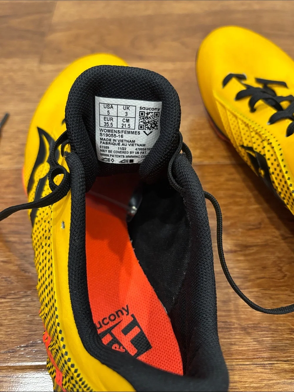Saucony Yellow Black Sprint Spikes with Orange Sole